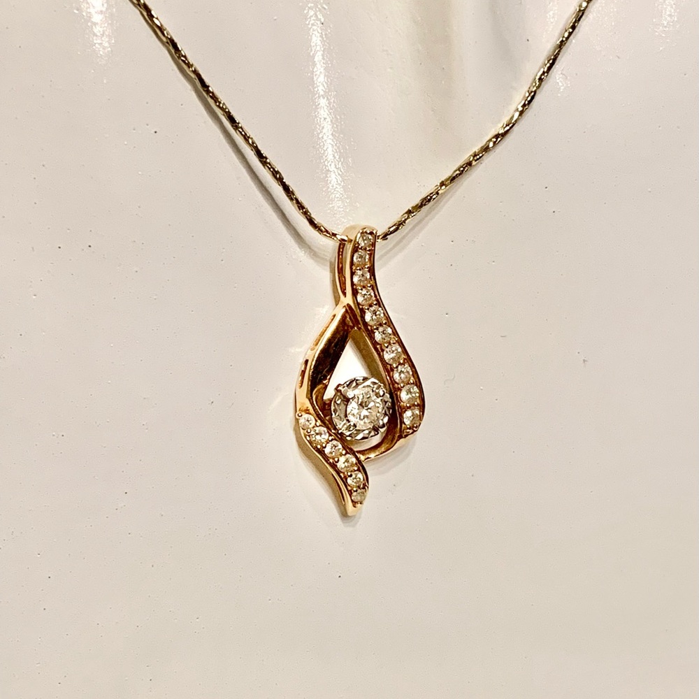 Diamond on Gold swirl pendant